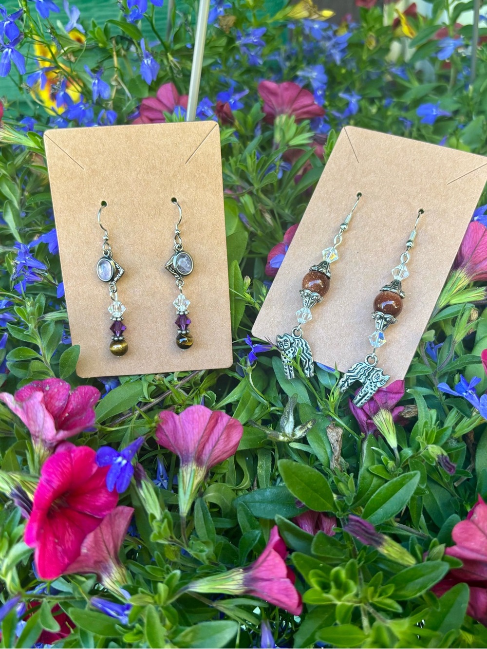 Two pairs of handcrafted dangle earrings.